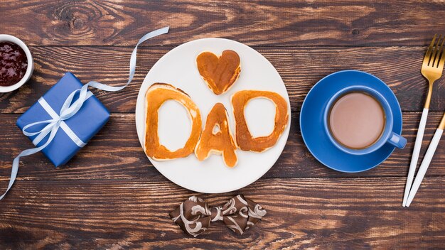 Dad word written in bread buns flat lay