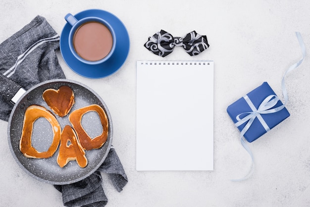 Dad word written in bread buns and gifts