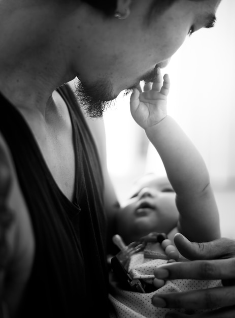 Free photo daddy carrying his baby family emotion at home