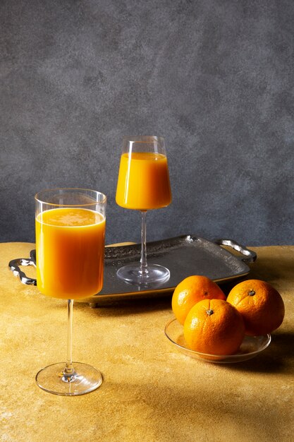 daiquiri cocktails and oranges arrangement