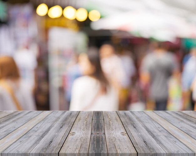 Damaged boards with unfocused people background