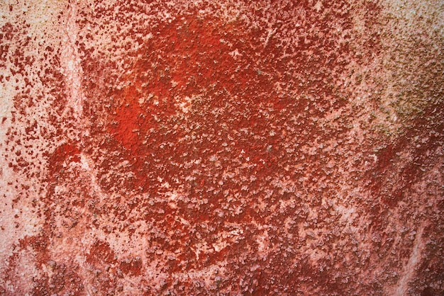 損傷を受けた赤い壁の背景