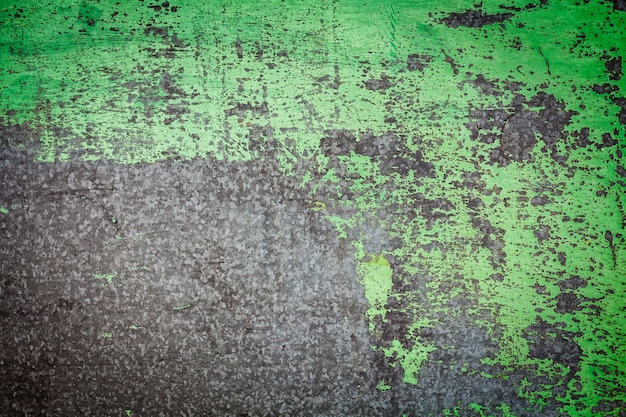 Damaged textured with green paint