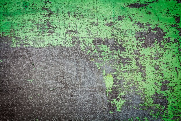 Damaged textured with green paint