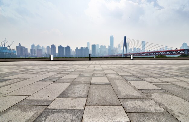 Damp pavement with buildings background