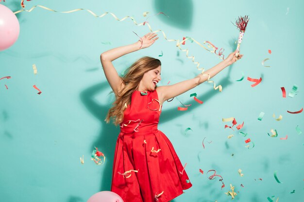 Dancing girl at party with confetti