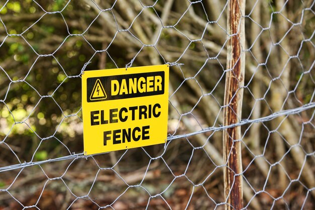 Danger sign hung from the electric fence