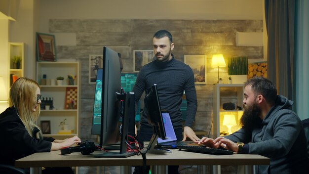 Dangerous hacker with his team doing cyber crimes from his apartment.