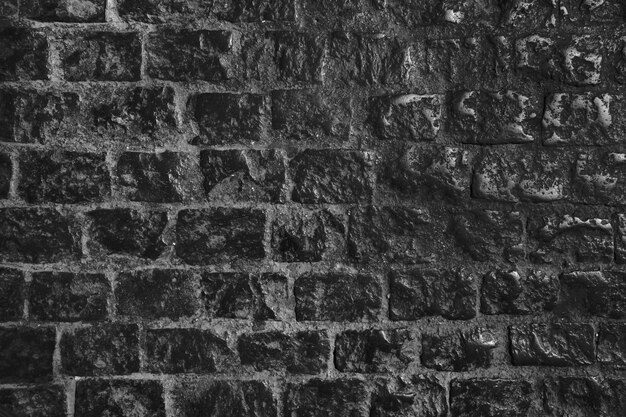 Dark aged brick wall