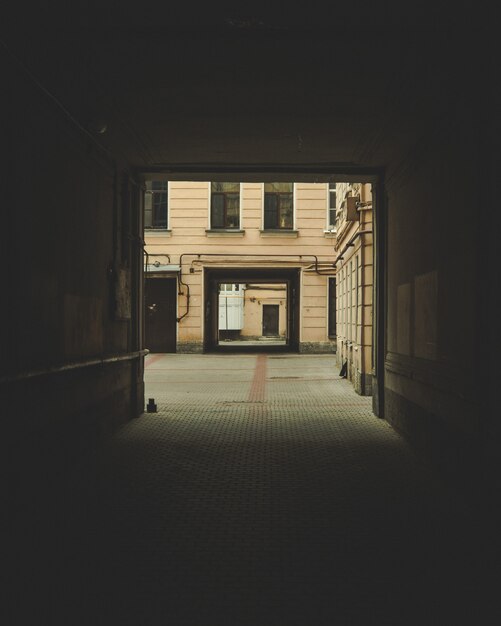 dark archway with a building visible in the background