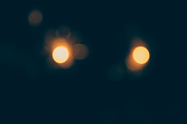 Free photo dark background of bokeh lights