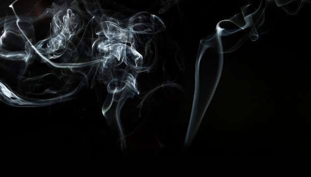 Free photo dark background with silhouettes of smoke