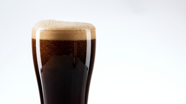 Dark beer with foam closeup