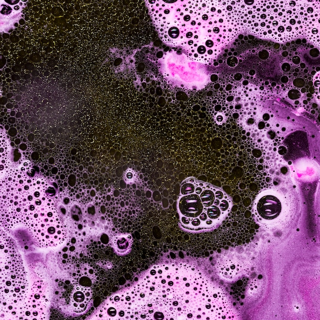 Dark blobs between pink foam 