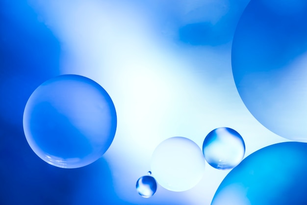 Free photo dark blue abstract background with bubbles