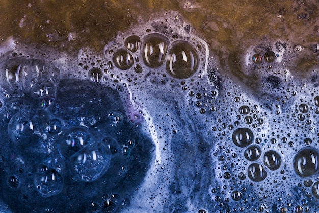 Free photo dark blue bath bomb in water