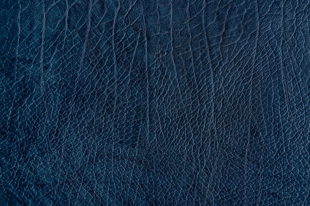 Dark blue creased leather textured background