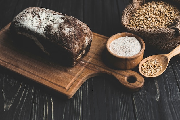 Dark bread on wooden board