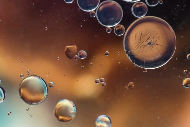 Dark brown abstract background with bubbles