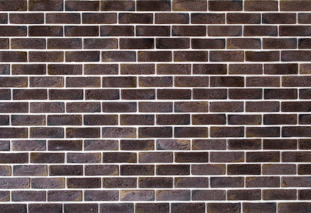 Dark brown brick wall, creative back-phonon, closeup