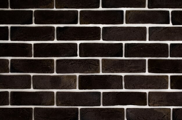 Dark brown brick wall, creative back-phonon, closeup