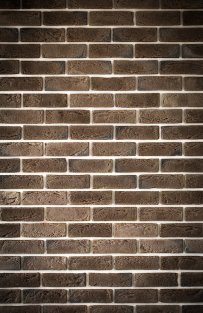 Free photo dark brown brick wall, creative back-phonon, closeup