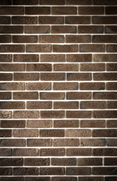 Dark brown brick wall, creative back-phonon, closeup