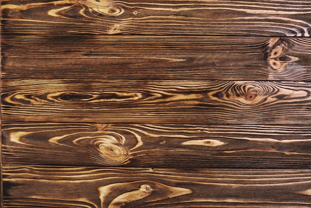 Free photo dark brown wood texture