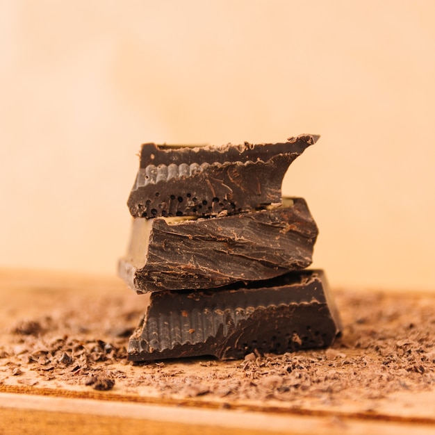 Dark chocolate and chocolate chips on chopping board