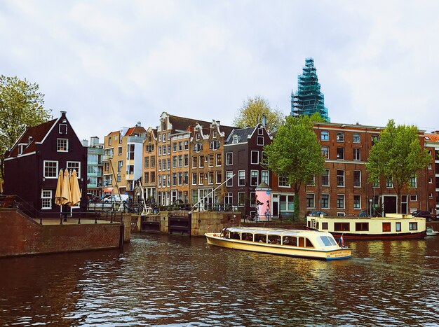 Dark clouds over canal in Amsterdam