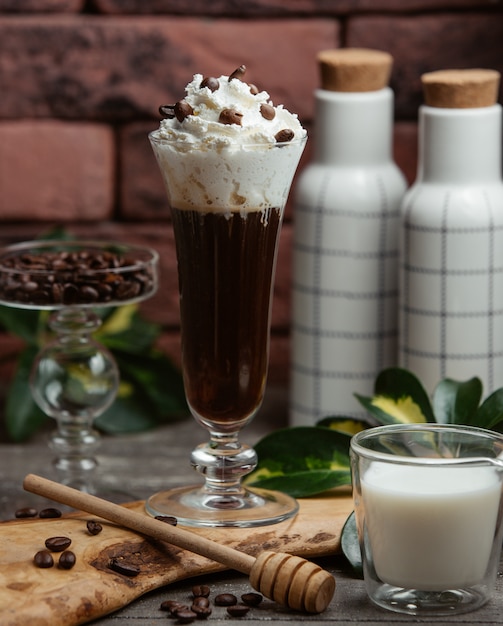 dark cold coffee with white whipped cream