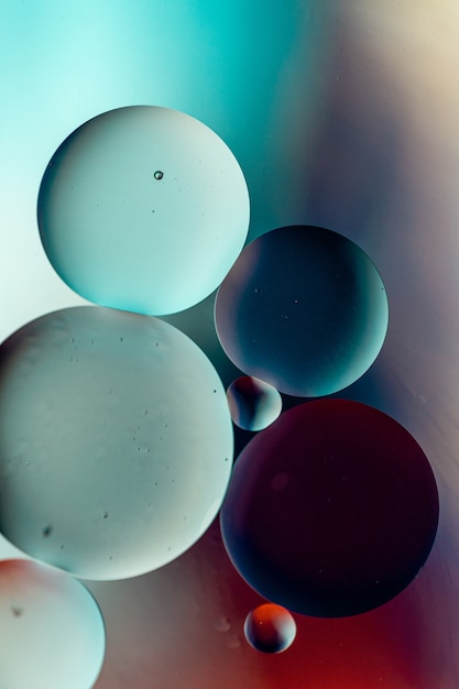 Free photo dark-colored circles on a colorful surface