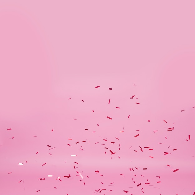 ピンクの背景に暗い紙吹雪