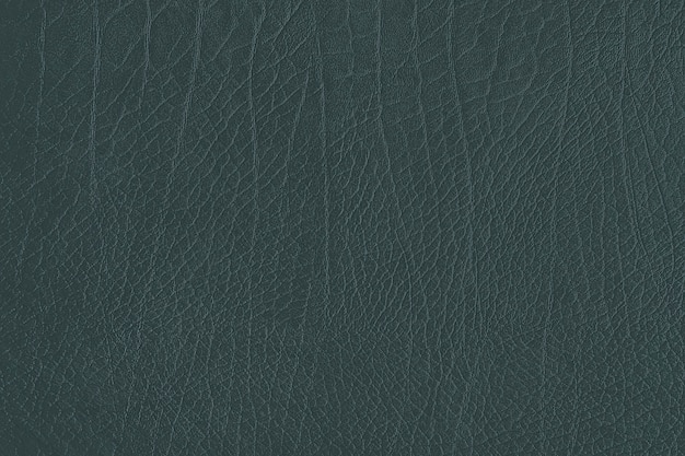 Free photo dark green creased leather textured background