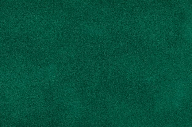 Dark green matt suede fabric  velvet texture,