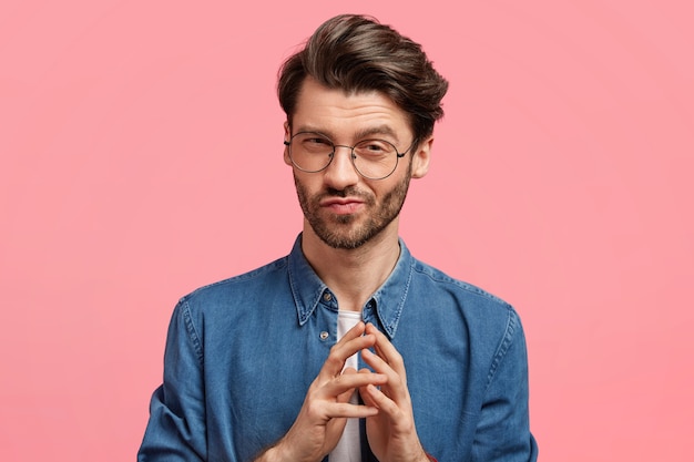 Dark-haired man wearing denim shirt