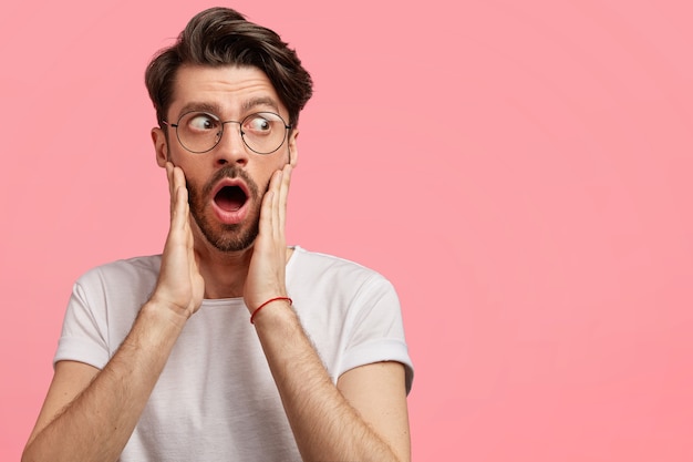 Dark-haired man with round glasses