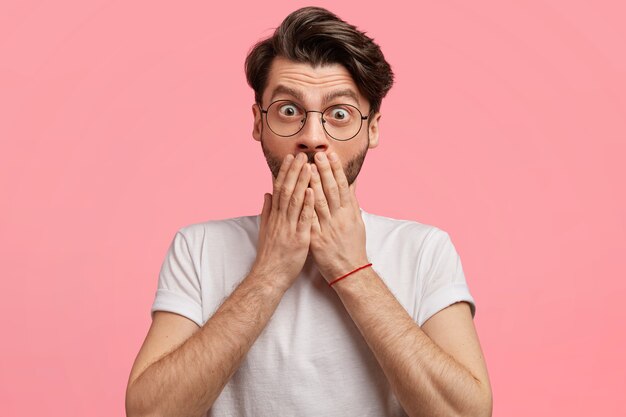 Dark-haired man with round glasses