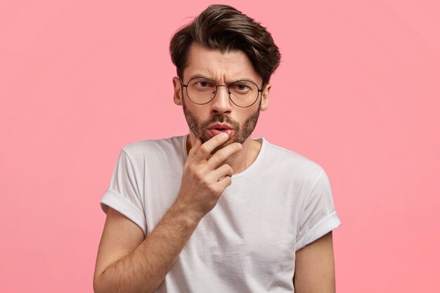 Dark-haired man with round glasses