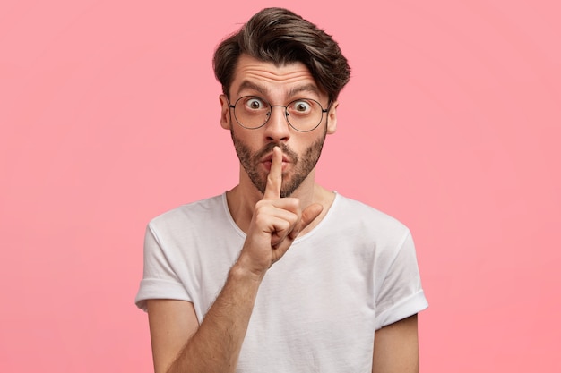 Dark-haired man with round glasses