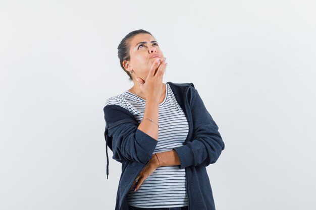 Dark-haired woman in shirt