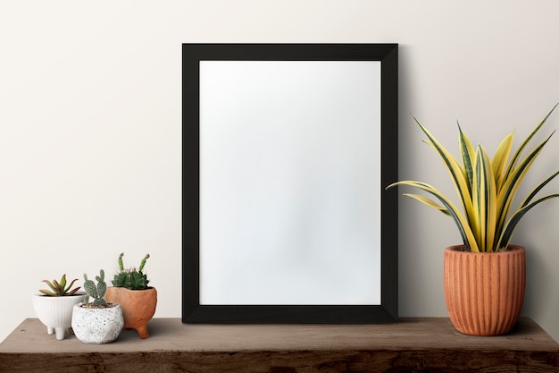 Dark modern blank picture frame on a shelf