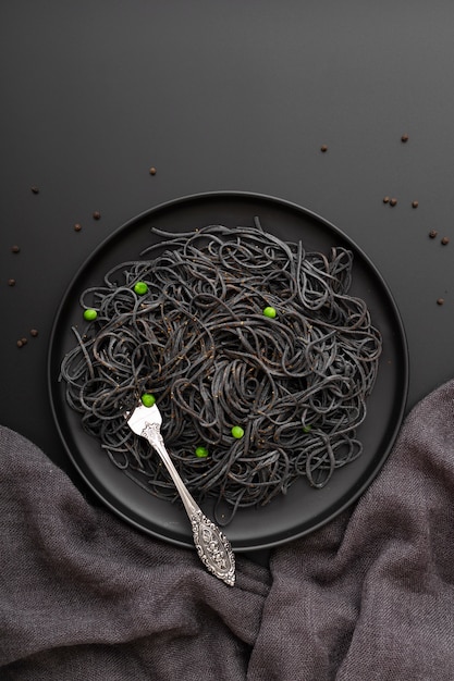 Dark pasta plate on a dark background
