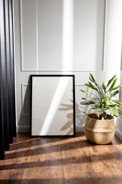 Dark photo frame and plant arrangement