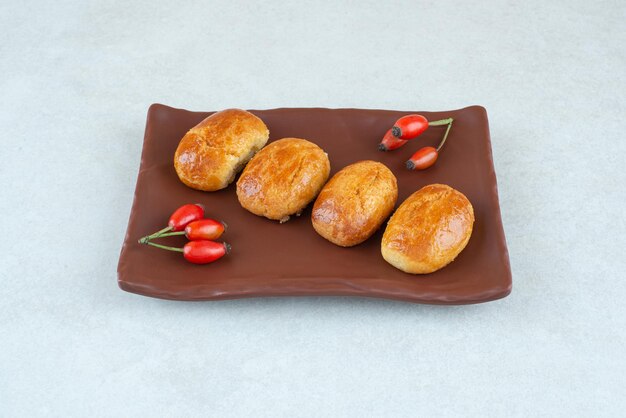 A dark plate of sweet delicious cookies