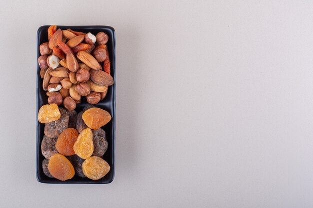 Dark plate of various organic nuts