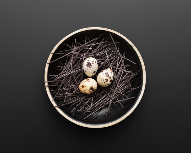 Dark plate with eggs on a dark background