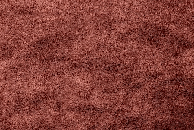 濃い赤の光沢のある織り目加工紙の背景