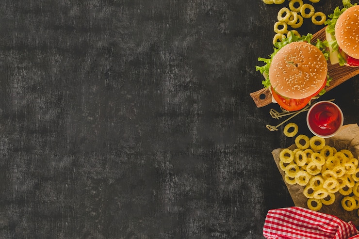 Free Photo dark surface with blank space and fast food menu