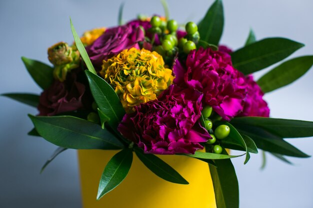 Dark violet and yellow hydrangeas put in a box